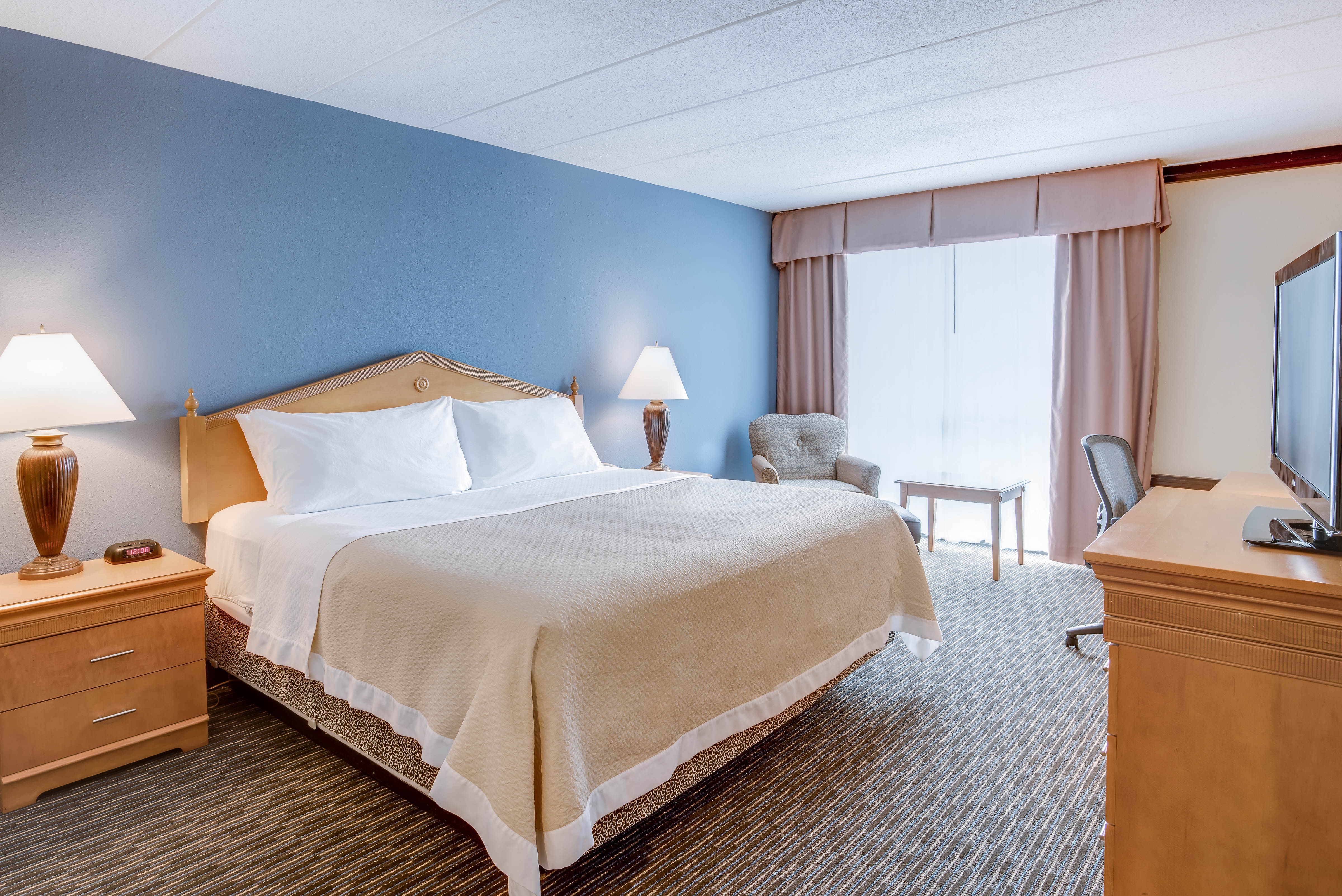 Guest room at the Days Hotel by Wyndham Toms River Jersey Shore in Toms River, New Jersey